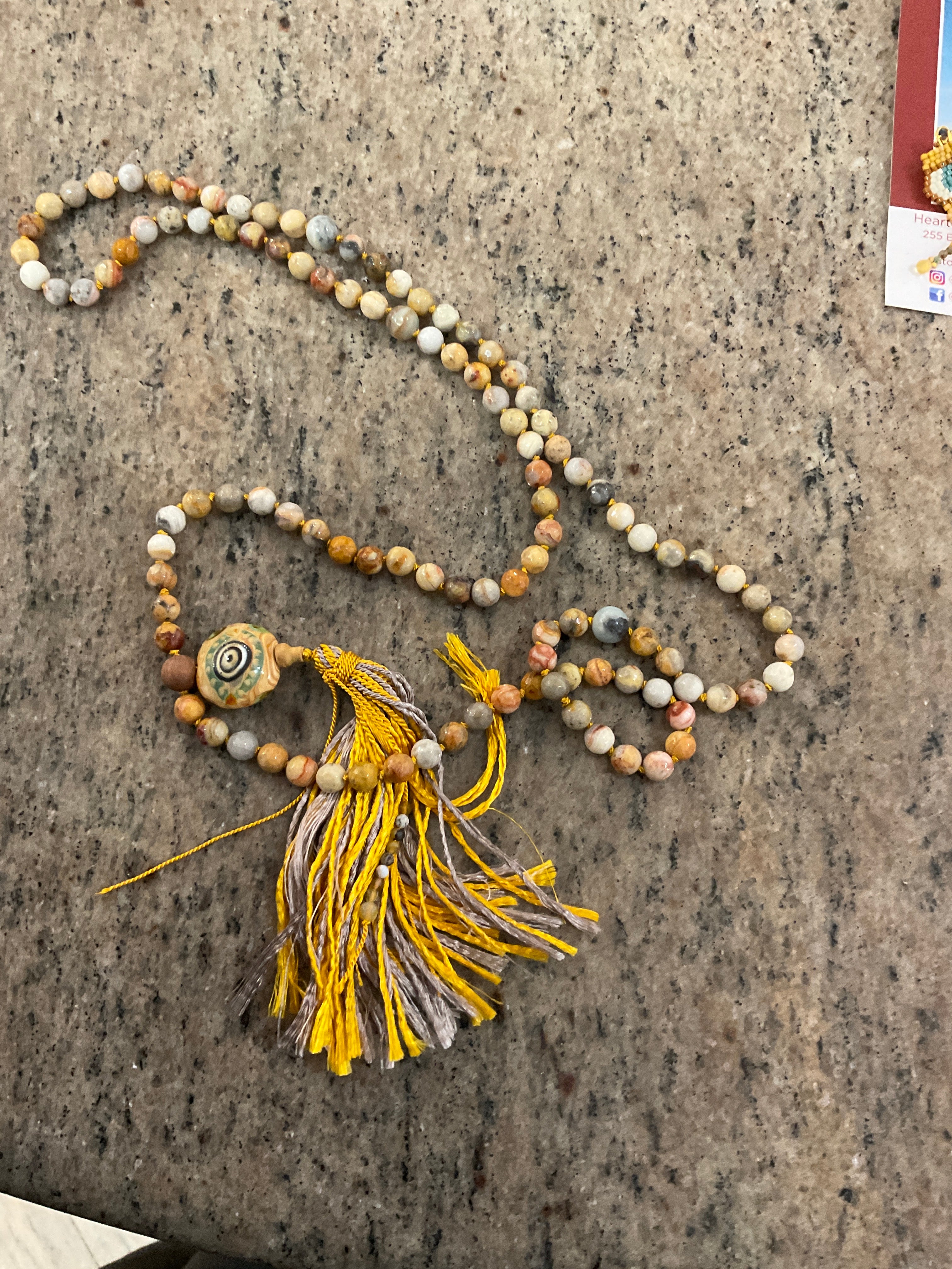 #73A evil eye mala crazy lace agate